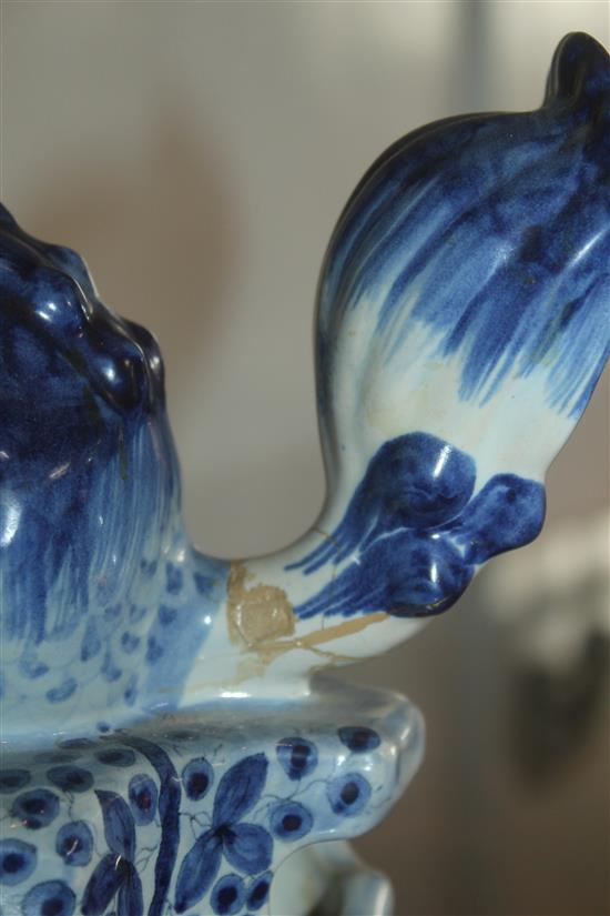 A 19th century French faience clock garniture, clock 18in.